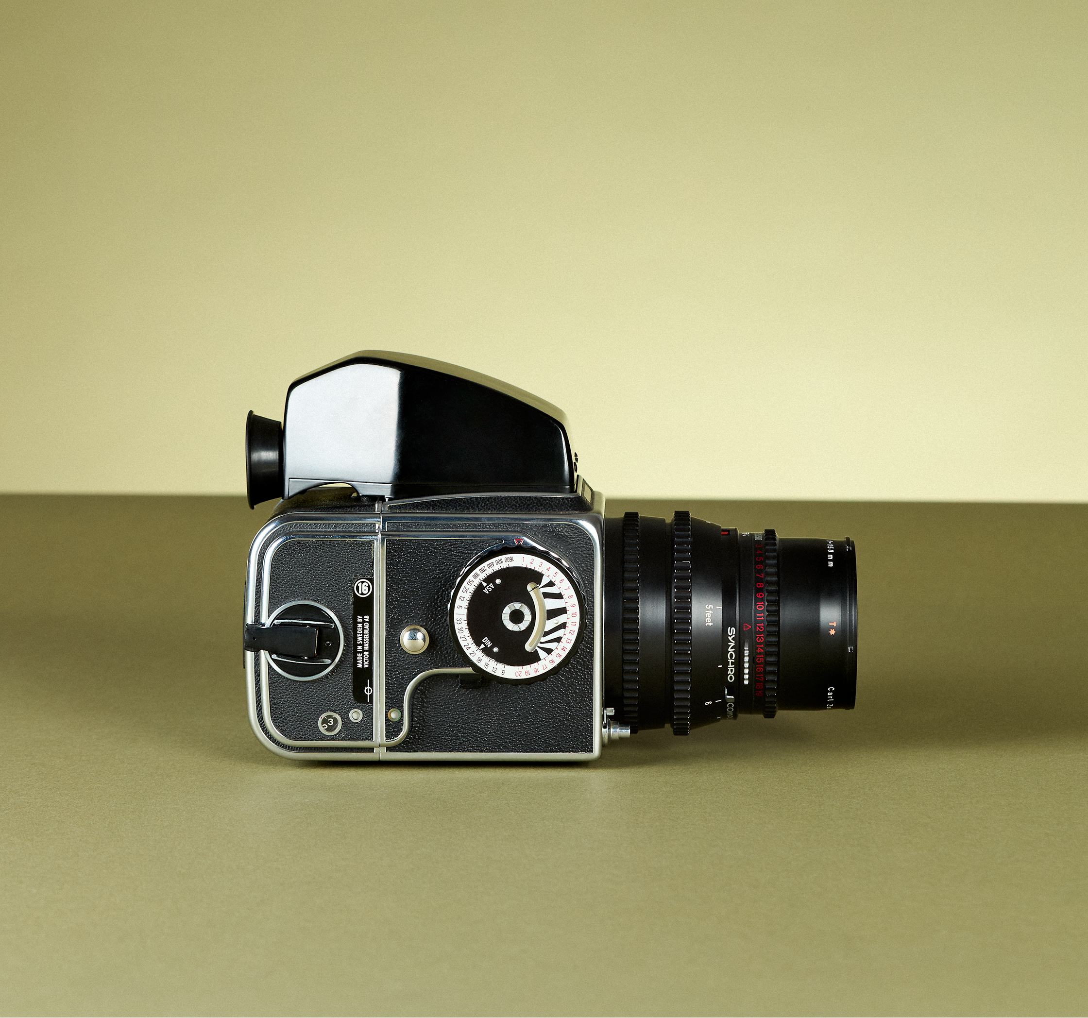 Vintage camera on a matching beige background