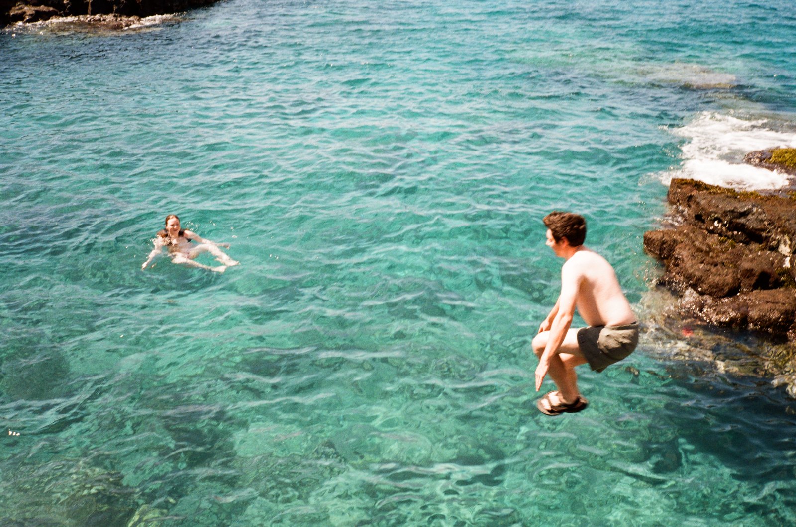 Swimmers off a rocky coast, shot on 35mm
