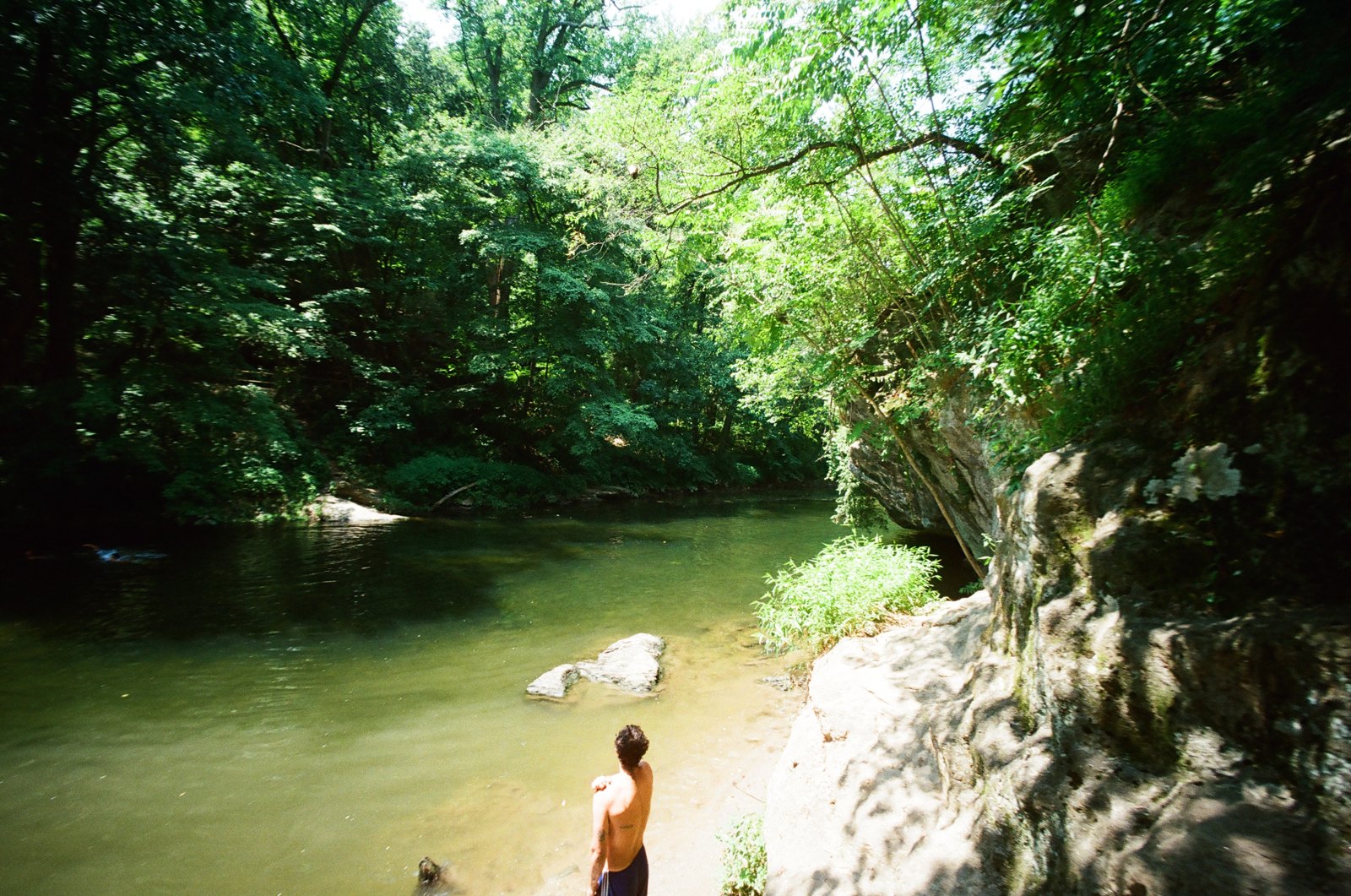 Swimmer in a green creek, shot on 35mm